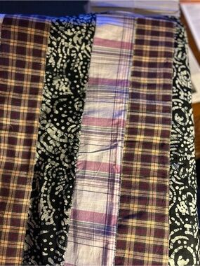 Still on bolt:fabric features strips/batik,plaid,madras. 17&2/3 ft long by42wide